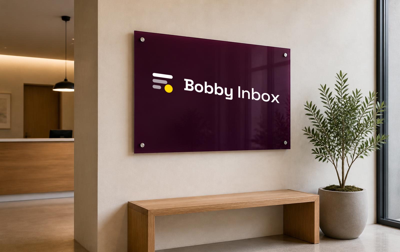 Reception wall signage carrying the Bobby Inbox Signal Stack lockup